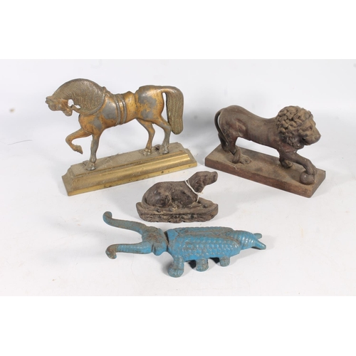 484 - Cast iron door stop in the form of a lion, and another in the form of a horse, a scarab beetle boot ... 