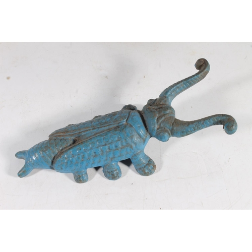 484 - Cast iron door stop in the form of a lion, and another in the form of a horse, a scarab beetle boot ... 