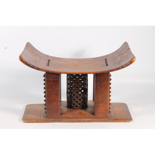 545 - Antique hardwood stool in the form of an African Ashanti neck rest, 47cm wide.