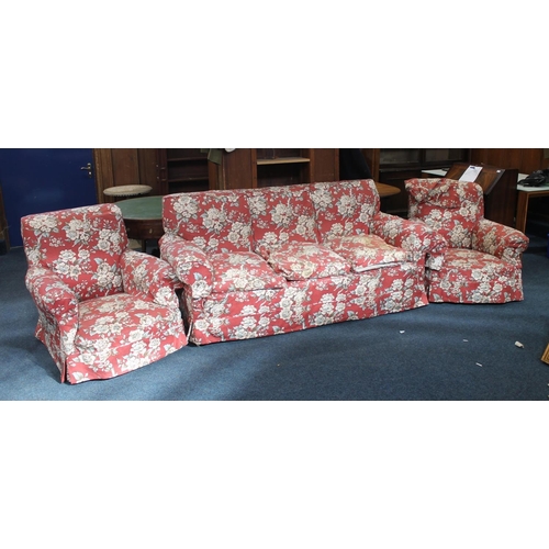 548 - Early 20th century three seat settee with red ground floral patterned covers, and a pair of matching... 