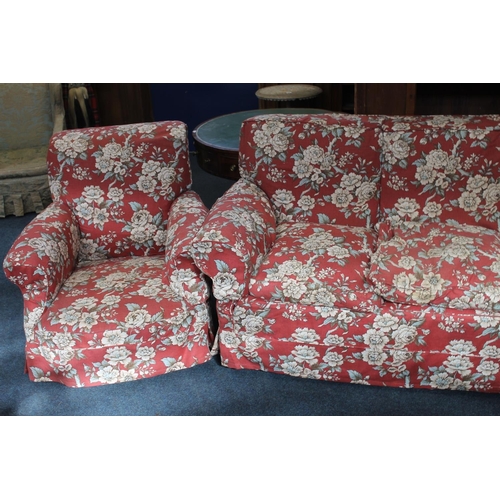 548 - Early 20th century three seat settee with red ground floral patterned covers, and a pair of matching... 