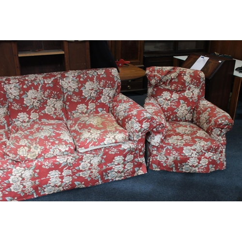 548 - Early 20th century three seat settee with red ground floral patterned covers, and a pair of matching... 