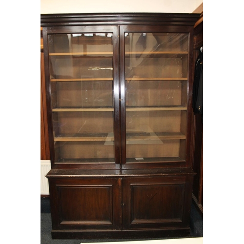 555 - Antique mahogany cabinet bookcase, the moulded cornice above two glaze panel cupboard doors over two... 