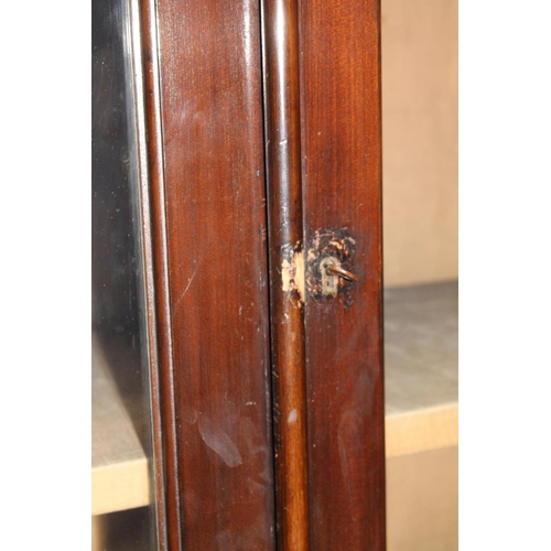 555 - Antique mahogany cabinet bookcase, the moulded cornice above two glaze panel cupboard doors over two... 