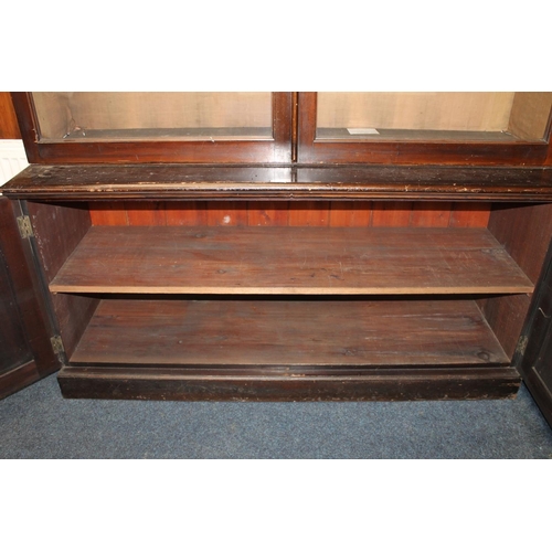 555 - Antique mahogany cabinet bookcase, the moulded cornice above two glaze panel cupboard doors over two... 