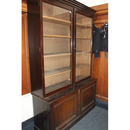 555 - Antique mahogany cabinet bookcase, the moulded cornice above two glaze panel cupboard doors over two... 