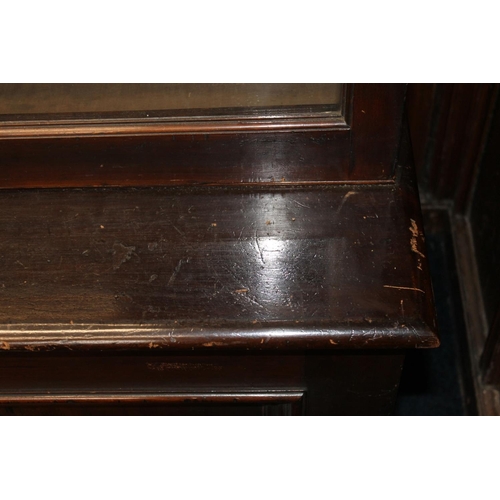 555 - Antique mahogany cabinet bookcase, the moulded cornice above two glaze panel cupboard doors over two... 