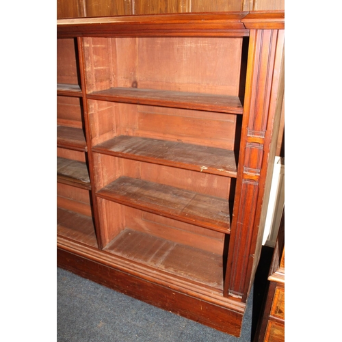 571 - Mahogany open bookcase in the Aesthetic movement style, 154cm long.