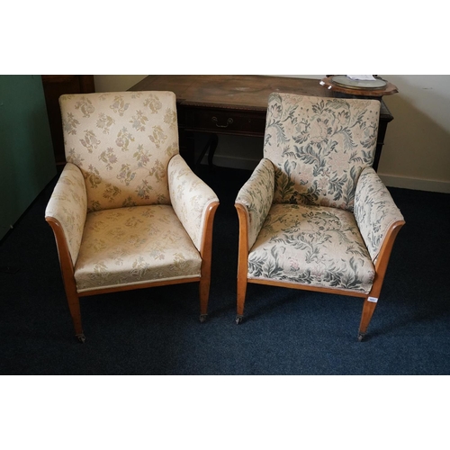 580 - Pair of 19th century lounge chairs raised on square tapering supports, 88cm x 66cm.