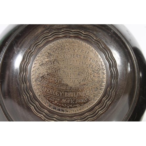 163 - Pair of lawn bowls with silver plaques inscribed 