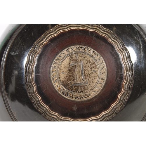 163 - Pair of lawn bowls with silver plaques inscribed 