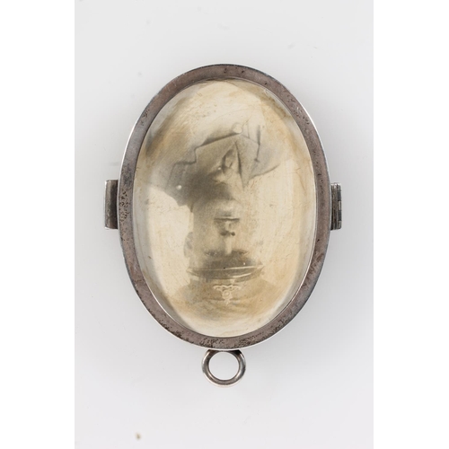 165 - Asprey and Co of London, an oval silver photograph locket, London 1914, 8cm tall.