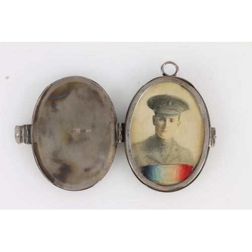 165 - Asprey and Co of London, an oval silver photograph locket, London 1914, 8cm tall.