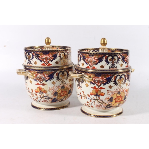 431 - Pair of Derby porcelain ice pails decorated in the Imari palate, 27cm tall.