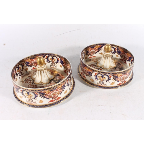 431 - Pair of Derby porcelain ice pails decorated in the Imari palate, 27cm tall.