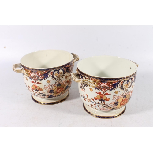 431 - Pair of Derby porcelain ice pails decorated in the Imari palate, 27cm tall.