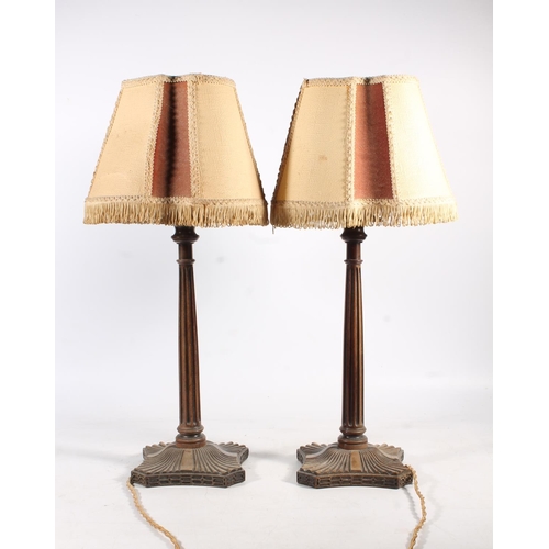 489 - Pair of mahogany fluted column table lamps, raised on fluted square platform base, 54cm tall to the ... 