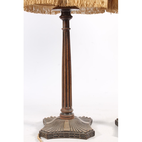 489 - Pair of mahogany fluted column table lamps, raised on fluted square platform base, 54cm tall to the ... 