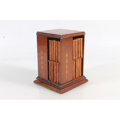 492 - Miniature mahogany and marquetry inlaid revolving bookstand with leather bound miniature Shakespeare... 