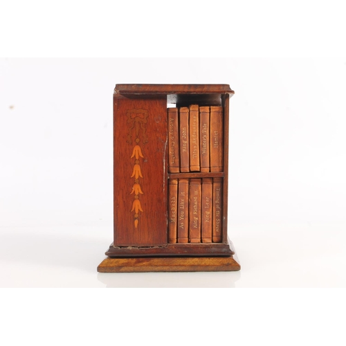 492 - Miniature mahogany and marquetry inlaid revolving bookstand with leather bound miniature Shakespeare... 