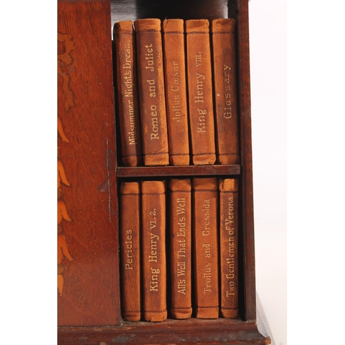 492 - Miniature mahogany and marquetry inlaid revolving bookstand with leather bound miniature Shakespeare... 