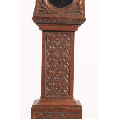 493 - Antique chip carved mahogany 'poor man's clock' pocket watch stand in the form of a miniature grandf... 