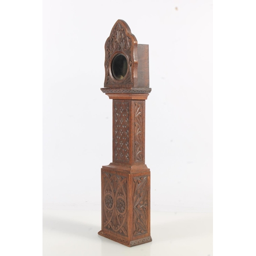 493 - Antique chip carved mahogany 'poor man's clock' pocket watch stand in the form of a miniature grandf... 