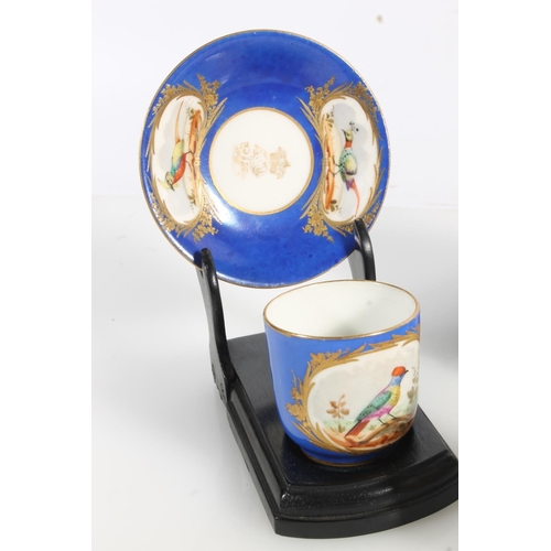 499 - Two Sèvres French porcelain cabinet cups and saucers decorated with hand painted vignette depicting ... 