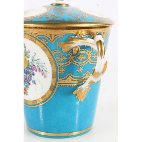 500 - French Sèvres porcelain chocolate cup and cover with matching stand having blue gilt borders and han... 