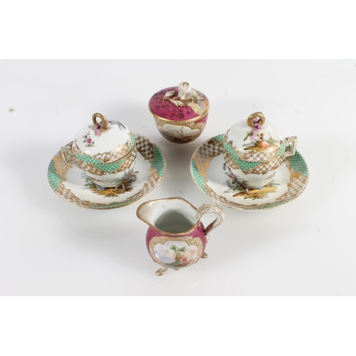 501 - Pair of Continental porcelain chocolate cups and covers on stands having green and gilt borders and ... 