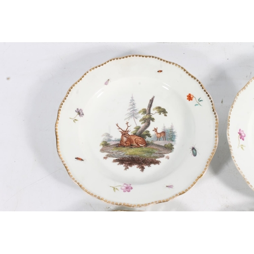 502 - Two 19th century Continental porcelain plates with reticulated border edges and hand painted bird de... 