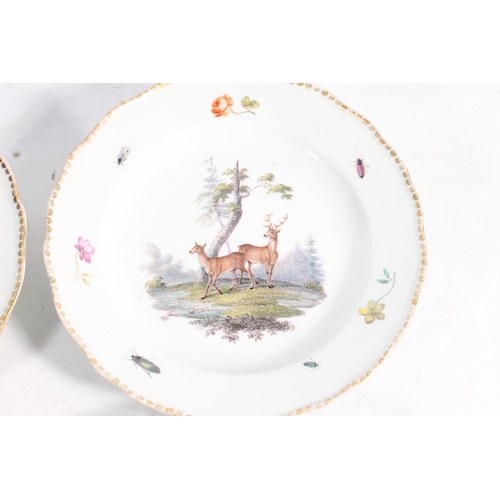 502 - Two 19th century Continental porcelain plates with reticulated border edges and hand painted bird de... 