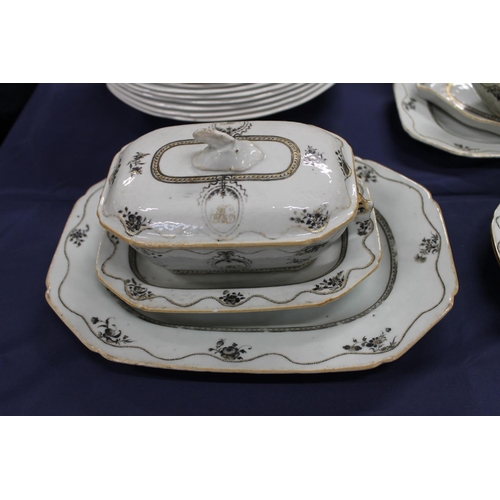 503 - 19th century porcelain part dinner set decorated with black and gilt design, having central cartouch... 