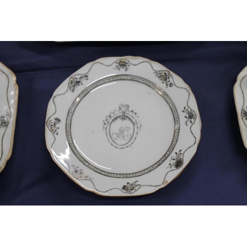 503 - 19th century porcelain part dinner set decorated with black and gilt design, having central cartouch... 