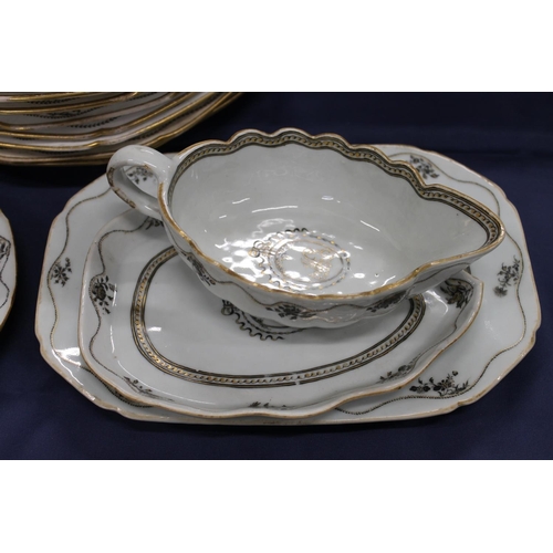 503 - 19th century porcelain part dinner set decorated with black and gilt design, having central cartouch... 