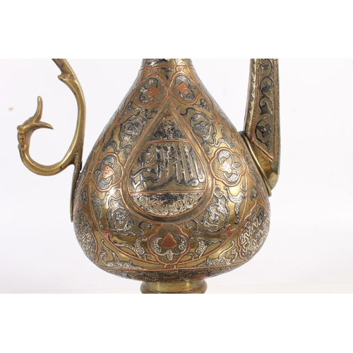 508 - Islamic Mamluk Revival type copper and silver inlaid brass coffee pot with Arabic script, 42cm tall ... 