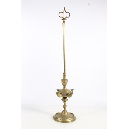 509 - Unusual Anglo Indian brass four light rush oil lamp with all over incised floral pattern, 67cm tall.