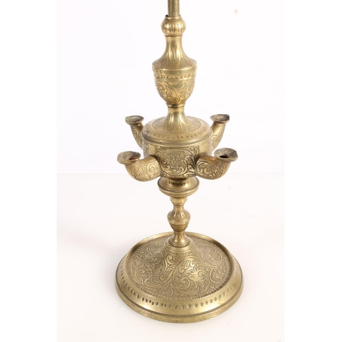 509 - Unusual Anglo Indian brass four light rush oil lamp with all over incised floral pattern, 67cm tall.