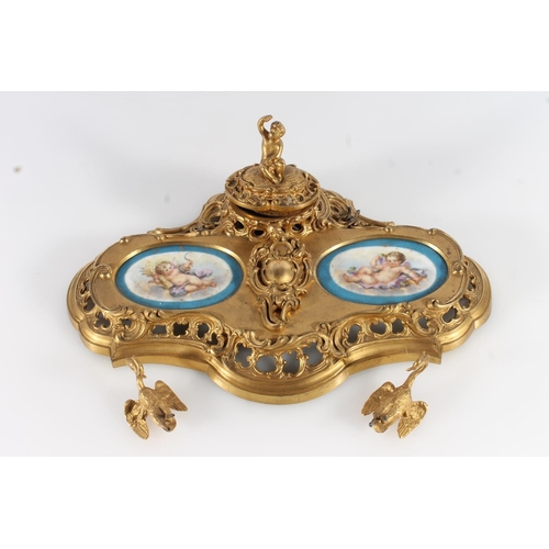 512 - French gilt metal ormolu style deskstand in the Rococo style inset with Sèvres style porcelai... 