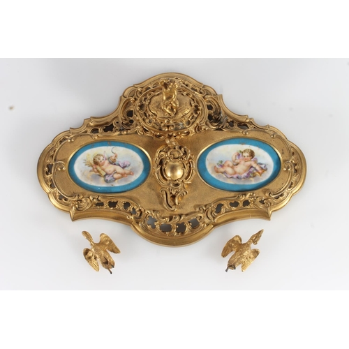 512 - French gilt metal ormolu style deskstand in the Rococo style inset with Sèvres style porcelai... 