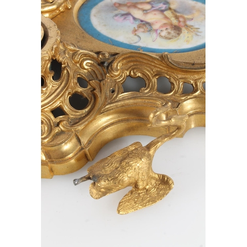 512 - French gilt metal ormolu style deskstand in the Rococo style inset with Sèvres style porcelai... 