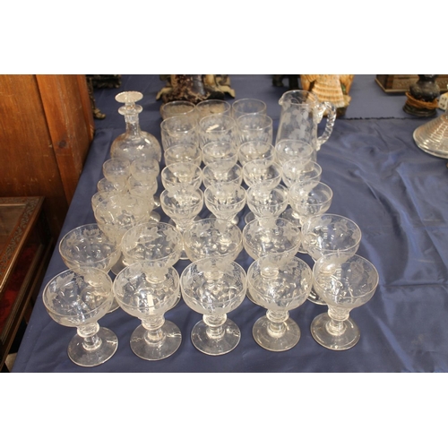 516 - Mixed suite of etched glassware with fruiting grape vine decoration comprising decanters, jug, rumme... 