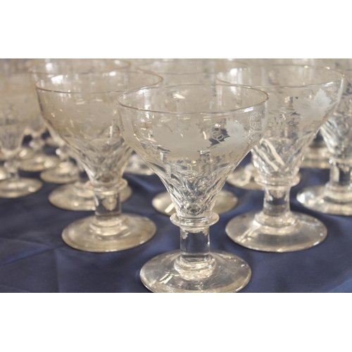 516 - Mixed suite of etched glassware with fruiting grape vine decoration comprising decanters, jug, rumme... 