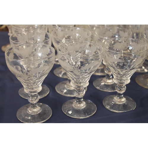 516 - Mixed suite of etched glassware with fruiting grape vine decoration comprising decanters, jug, rumme... 