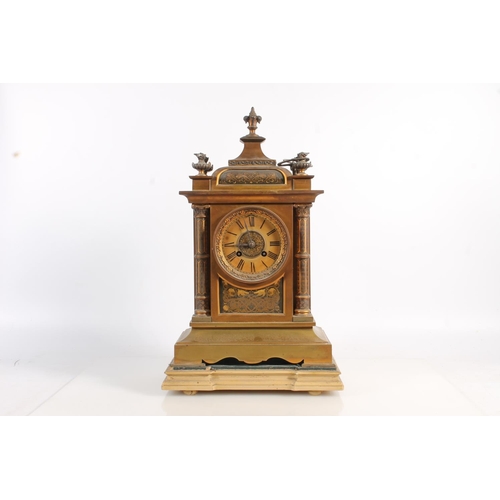 517 - Antique French gilt metal mantle clock decorated with damascene work to the panels and the columns, ... 