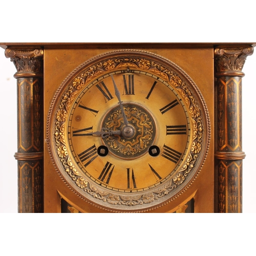 517 - Antique French gilt metal mantle clock decorated with damascene work to the panels and the columns, ... 