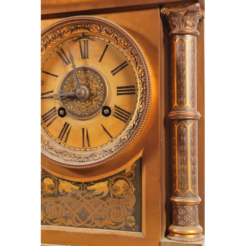 517 - Antique French gilt metal mantle clock decorated with damascene work to the panels and the columns, ... 