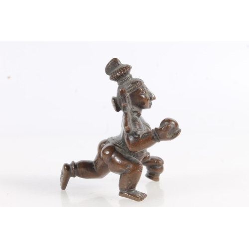 520 - Hindu bronze model of Krishna, 7cm tall, and a small bronze model of an animal. (2)