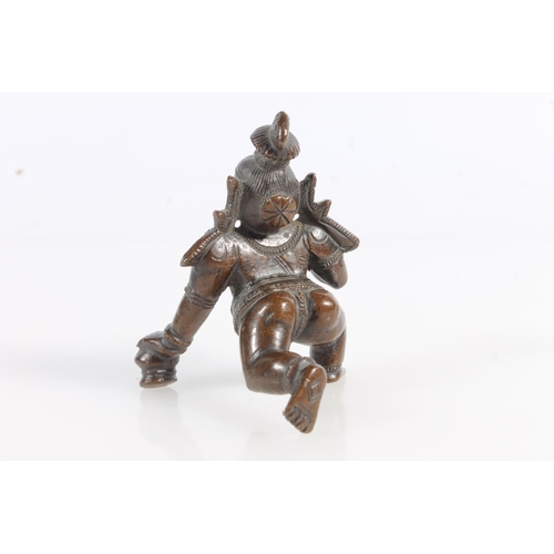 520 - Hindu bronze model of Krishna, 7cm tall, and a small bronze model of an animal. (2)