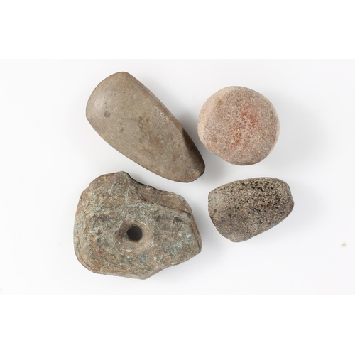 523 - Antiquities, two early stone axe heads, a burr type stone and another. (4)